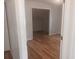 View of the bedroom featuring hardwood floors and an open closet area at 2181 Wekiwa Oaks Dr, Apopka, FL 32703