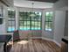 Cozy breakfast nook area surrounded by windows and a lovely view of the backyard and pool area at 2181 Wekiwa Oaks Dr, Apopka, FL 32703