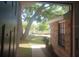 Welcoming entryway view showing a well-maintained brick exterior and lush front yard landscaping at 2181 Wekiwa Oaks Dr, Apopka, FL 32703