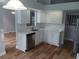 Modern kitchen featuring white cabinetry, stainless steel appliances, and stylish countertops at 2181 Wekiwa Oaks Dr, Apopka, FL 32703
