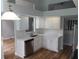 Modern kitchen featuring white cabinetry, stainless steel appliances, and stylish countertops at 2181 Wekiwa Oaks Dr, Apopka, FL 32703