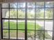 View from window overlooking a beautiful, lush green front lawn at 2181 Wekiwa Oaks Dr, Apopka, FL 32703