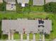 Overhead view highlights the property and its relationship to the adjacent neighborhood with mature trees at 2311 Chatham Place Dr, Orlando, FL 32824