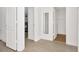 A bright bedroom is shown, with doors leading to a bathroom and closet for maximum convenience at 2311 Chatham Place Dr, Orlando, FL 32824