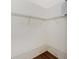 Walk in closet features custom wire shelving and laminate wood flooring at 2311 Chatham Place Dr, Orlando, FL 32824