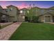 Beautiful two-story home with a well-manicured lawn and brick driveway at 2311 Chatham Place Dr, Orlando, FL 32824