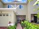 Inviting entryway featuring brick accents and lush landscaping at 2311 Chatham Place Dr, Orlando, FL 32824