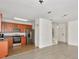 Open-concept kitchen with wood cabinets and stainless steel appliances at 2311 Chatham Place Dr, Orlando, FL 32824