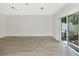 Bright living room with sliding glass doors leading to the backyard with new flooring at 2311 Chatham Place Dr, Orlando, FL 32824