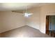 Bedroom with carpet, ceiling fan, and adjacent doorway at 2555 Palmetto Ridge Cir, Apopka, FL 32712