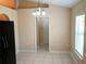 Bright dining area with tile floors and natural light, open to the kitchen at 2555 Palmetto Ridge Cir, Apopka, FL 32712