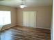 Bright dining area featuring wood-look flooring and sliding glass door at 2555 Palmetto Ridge Cir, Apopka, FL 32712