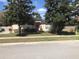 Lovely single-story home with mature trees, a well-kept lawn, and a welcoming entrance at 2555 Palmetto Ridge Cir, Apopka, FL 32712