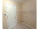 Laundry room with tile flooring and a single shelf at 2555 Palmetto Ridge Cir, Apopka, FL 32712