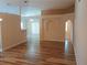 Open floor plan showcasing seamless transitions and beautiful laminate floors throughout the living area at 2555 Palmetto Ridge Cir, Apopka, FL 32712
