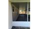 View of the spacious screened porch, perfect for enjoying the outdoors in comfort at 2555 Palmetto Ridge Cir, Apopka, FL 32712