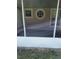 The home features a screened porch with unique octagonal window at 2555 Palmetto Ridge Cir, Apopka, FL 32712