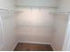 Walk-in closet features wire shelving for storage at 2555 Palmetto Ridge Cir, Apopka, FL 32712