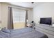 Relaxing bedroom with neutral decor, comfortable furnishings, and lots of natural light at 2598 Robert Trent Jones Dr # 1030, Orlando, FL 32835