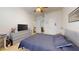Comfortable bedroom featuring ample closet space, neutral decor, and lots of natural light at 2598 Robert Trent Jones Dr # 1030, Orlando, FL 32835