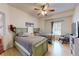 Inviting bedroom featuring two twin beds, a ceiling fan, and a window for natural light at 2598 Robert Trent Jones Dr # 1030, Orlando, FL 32835