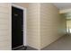 Exterior shot of front door with black paint and gold hardware and the number 1030 at 2598 Robert Trent Jones Dr # 1030, Orlando, FL 32835