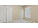 This bedroom features neutral walls, carpet floors, and a window with light filtering blinds at 2674 Spicebush Loop, Apopka, FL 32712