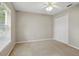 This bedroom features neutral walls, carpet floors, a ceiling fan and a window with light filtering blinds at 2674 Spicebush Loop, Apopka, FL 32712
