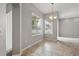 Charming dining space with tile flooring, pendant lighting, and a bright, airy feel due to large windows at 2674 Spicebush Loop, Apopka, FL 32712