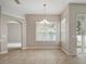Stylish dining area with tile floors, bright windows, and open access, perfect for entertaining guests at 2674 Spicebush Loop, Apopka, FL 32712