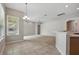 Bright dining area featuring tile floors, modern lighting, and ample natural light from large windows at 2674 Spicebush Loop, Apopka, FL 32712