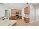 Well-equipped kitchen with stainless steel appliances, wood cabinets, and tile flooring for easy maintenance at 2674 Spicebush Loop, Apopka, FL 32712
