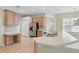 Spacious kitchen featuring modern appliances, ample counter space, and stylish tile flooring at 2674 Spicebush Loop, Apopka, FL 32712