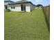 Spacious backyard with lush green grass and privacy fence at 2707 Virginia Pine Nw Dr, Bartow, FL 33830