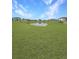 Large backyard with a serene pond view at 2707 Virginia Pine Nw Dr, Bartow, FL 33830