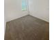 Bedroom with window and carpet at 2707 Virginia Pine Nw Dr, Bartow, FL 33830