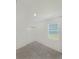 Bedroom with neutral carpet, double-door closet, and a window at 2707 Virginia Pine Nw Dr, Bartow, FL 33830