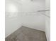 A walk-in closet with wire shelving and neutral carpeting at 2707 Virginia Pine Nw Dr, Bartow, FL 33830