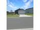 Cozy single-story home with a two-car garage and manicured front lawn at 2707 Virginia Pine Nw Dr, Bartow, FL 33830