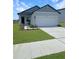 Charming single-Gathering home showcasing a well-kept lawn and attached two-car garage at 2707 Virginia Pine Nw Dr, Bartow, FL 33830