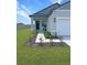 Inviting front entrance with stone accents and landscaping at 2707 Virginia Pine Nw Dr, Bartow, FL 33830