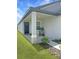 Charming covered front porch with stylish columns and a well-manicured lawn at 2707 Virginia Pine Nw Dr, Bartow, FL 33830