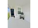 Welcoming front porch with a dark-blue front door, potted plants and stone accents at 2707 Virginia Pine Nw Dr, Bartow, FL 33830