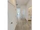 Tiled hallway with an open view to other rooms at 2707 Virginia Pine Nw Dr, Bartow, FL 33830