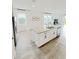 Bright kitchen island with granite countertops and stainless steel appliances at 2707 Virginia Pine Nw Dr, Bartow, FL 33830