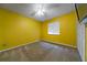 A bedroom features yellow walls and a ceiling fan at 2715 Wekiva Meadows Ct, Apopka, FL 32712
