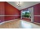 An empty dining room features hardwood floors, base molding, and a vaulted ceiling at 2715 Wekiva Meadows Ct, Apopka, FL 32712