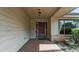 Inviting front porch with brick flooring, a decorative light fixture, and a view of the front door at 2715 Wekiva Meadows Ct, Apopka, FL 32712