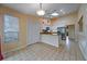 A kitchen features white cabinets, granite counters and stainless steel appliances at 2715 Wekiva Meadows Ct, Apopka, FL 32712