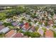 Aerial view of home surrounded by lush green trees and homes in neighborhood at 2933 Birmingham Blvd, Orlando, FL 32829
